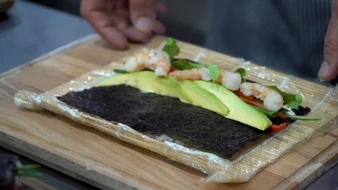 Making sushi by a chef Stock Footage 106628443