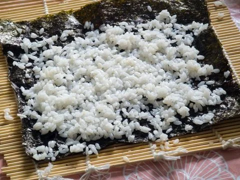 Making sushi. Preparing and making rolls in a restaurant and sushi bar. Stock Photos