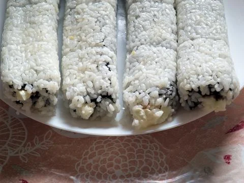 Making sushi. Preparing and making rolls in a restaurant and sushi bar. 写真素材