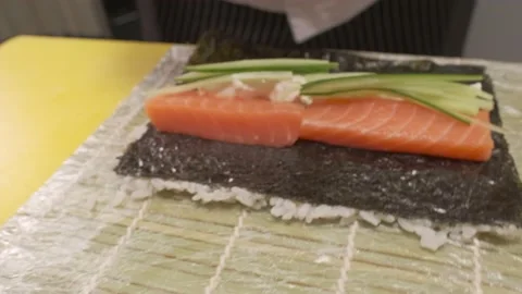 Making sushi rolls. Closeup. moving cam Stock Footage 231016600