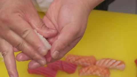 Making sushi with salmon, rice and wasabi Stock Footage 231016680