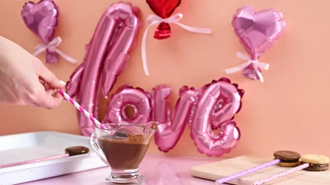 Making sweet desserts cake pops. Dip cake pops in melted black chocolate Stock Footage 168526883