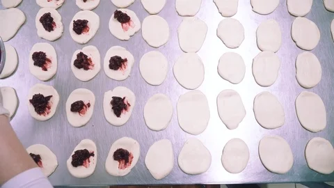 Making sweet dumplings at bakery with bakers  Video stock 73374265