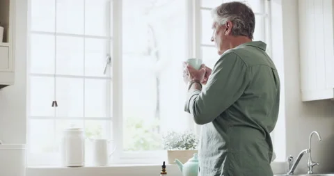 Making the switch to marijuana tea. 4k video footage of a senior man preparing a Stock Footage 201321213