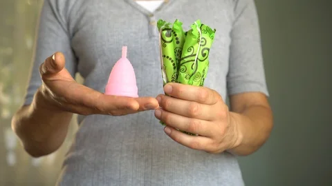 Making the switch from single use tampons to a reusable silicon menstrual cup Stock Footage 111114646
