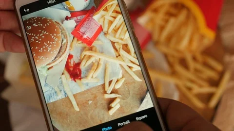 Making, taking photograph of stack, heap of unhealthy food, fast food, top view 스톡 동영상 126027484