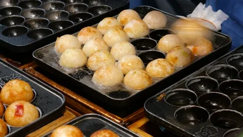 Making Takoyaki on the stall Stock Footage 254070814
