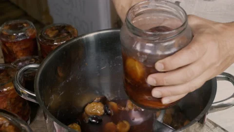 Making tasty plum compote Stock Footage 146064744
