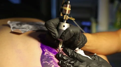 Making a tattoo Wolf om the back Stock Footage 66037459