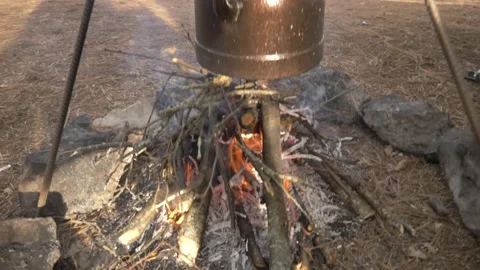 Making tea in the campfire_camping HD 1080 Stock Footage 147493884