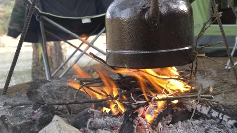 Making tea in the campfire_camping HD 1080 Stock Footage 147494093