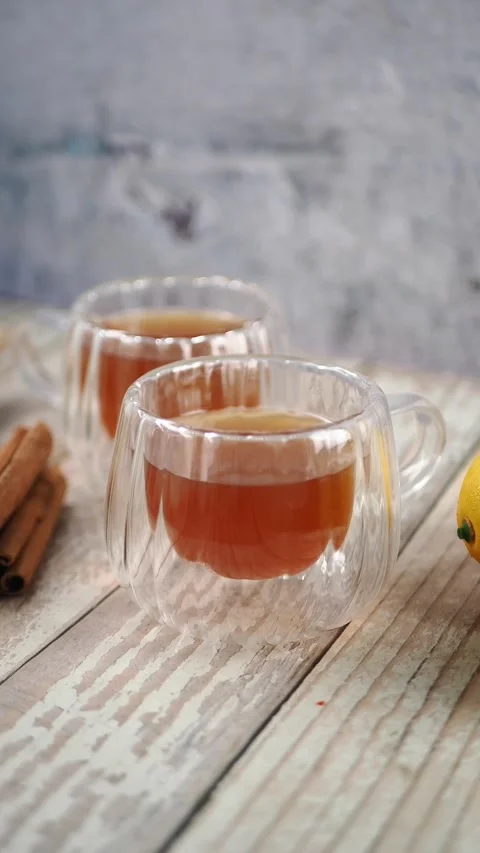 Making tea with fresh lemons on a rustic table Stock Footage 340178499