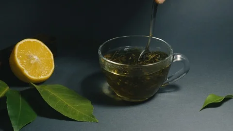 Making tea from herbs in a transparent glass cup Stock Footage 101111663