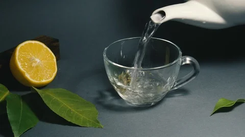 Making tea from herbs in a transparent glass cup Stock Footage 101111746