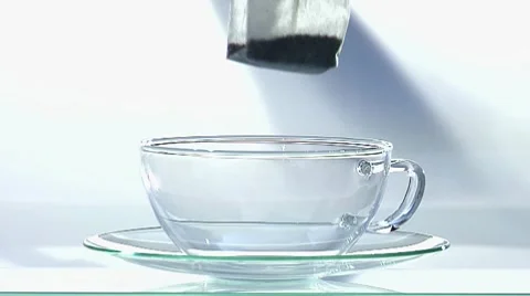 Making tea: pouring hot water onto tea bag Stock Footage 8570536
