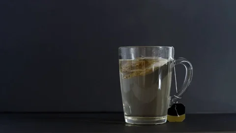 Making tea with tea bag in cup Stock Footage 121321574
