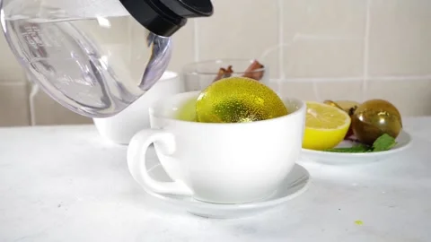 Making tea with tea ball bombs Stock Footage 168309074
