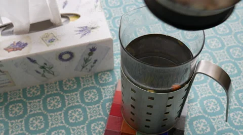 Making tea on a turquoise tablecloth Stock Footage 68908650