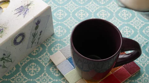 Making tea on a turquoise tablecloth Stock Footage 68908796