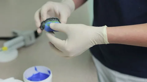 Making a template for temporary veneers. Dental technician making of denture in 스톡 동영상 194461735