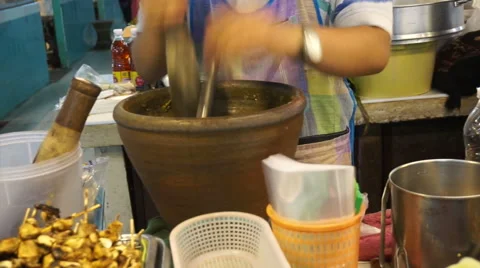 Making Thai chilli fresh paste in a mortar with pestle Stock-Footage 51212413