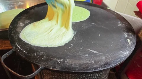 Making Thai Cotton Candy Crepe on Circular Hot Griddle. Stock Footage 340549661