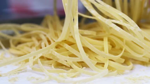 Making thin noodles for soup with rolling machine from special homemade dough Stock Footage 136560783