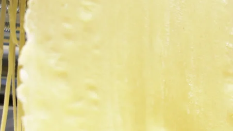 Making thin noodles for soup with rolling machine from special homemade dough Stock Footage 150668539