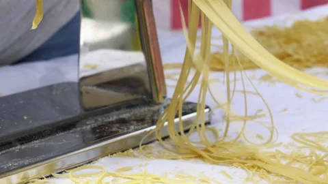 Making thin noodles for soup with rolling machine from special homemade dough Stock Footage 218133226