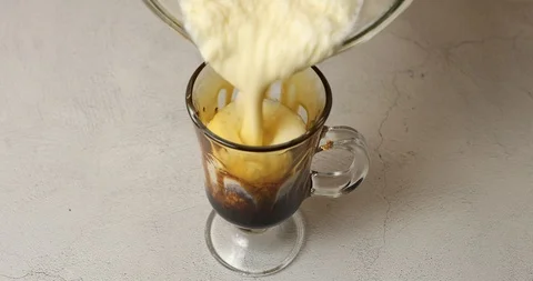 Making tiger patterns in glass cup to make black sugar milkshake Stock Footage 114204924