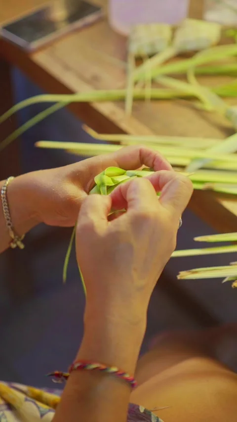 Making Tipat or Ketupat made from rice wrapped with Palm Leaf Stock Footage 337079788