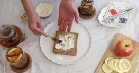 Making toast with nutter and apple cinnamon jam Stock Footage 105141876