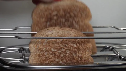 Making toasts in a toaster Stock Footage 84238349