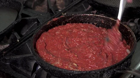 Making tomato on a frying pan Stock Footage 73622602