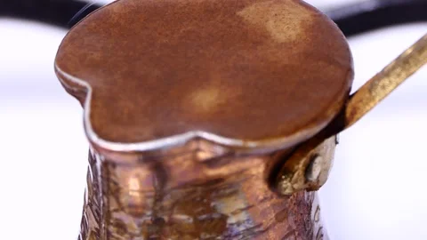 Making turkish coffee in copper cezve over gas stove Stock Footage 247789529
