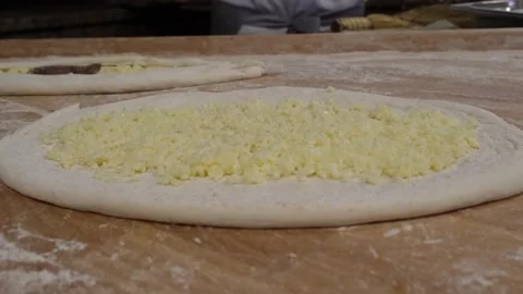 Making Turkish pide from dough Stock Footage 170117846