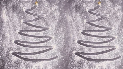Making two Christmas tree with baking flour. Stop motion Stock Footage 144413492