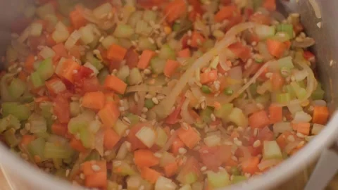 Making Vegetable Soup in a Cozy Home Kitchen – Ingredients and Cooking Process Stock Footage 296835871