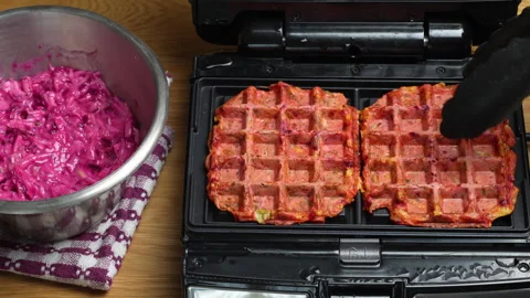 Making vegetarian beetroot and zucchini waffles with herbs in waffle maker Vídeos de archivo 331636983