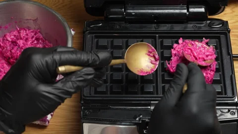 Making vegetarian beetroot and zucchini waffles with herbs in waffle maker Stock Footage 331637169