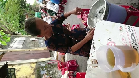 Making Vietnamese coffee on Hoi An sidewalk, Vietnam 스톡 동영상 248307341