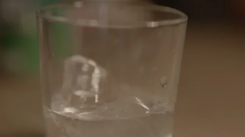 Making a vodka &amp; coke on ice, slow motion Stock Footage 56781571
