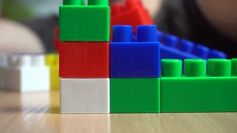 Making a wall from constructor bricks Stock Footage 72113316