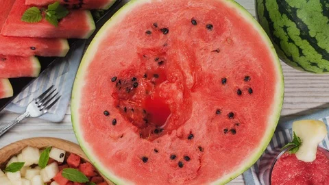 Making watermelon smoothie juice. Top view, stop motion animation. Stock Footage 113354792
