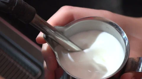 Making white milk froth using a coffee machine Stock Footage 117976407