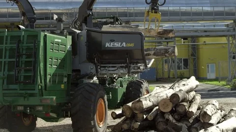Making wood chips from a large piece of wood at the factory Stock Footage 71271124