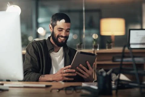 Making work as simple as can be. a young businessman using a digital tablet Stock Photos