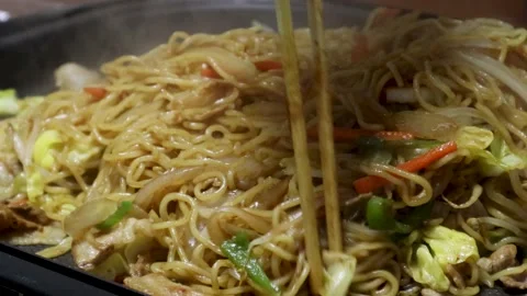Making yakisoba noodles with split noodles Stock Footage 236770988