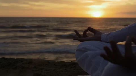 Making yoga position at the sunset on the beach: sea, woman, lonely, meditation Video stock 43098159
