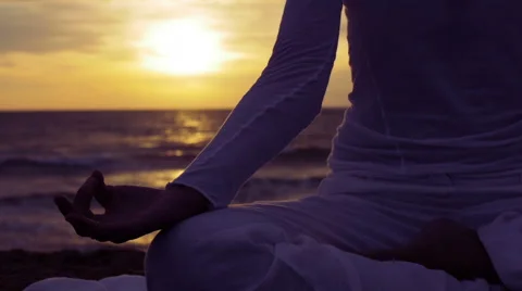 Making yoga position at the sunset on the beach: sea, woman, lonely, meditation Stock-Footage 43098218